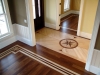 Combination of stain, painted borders and inlaid medallion in entry area